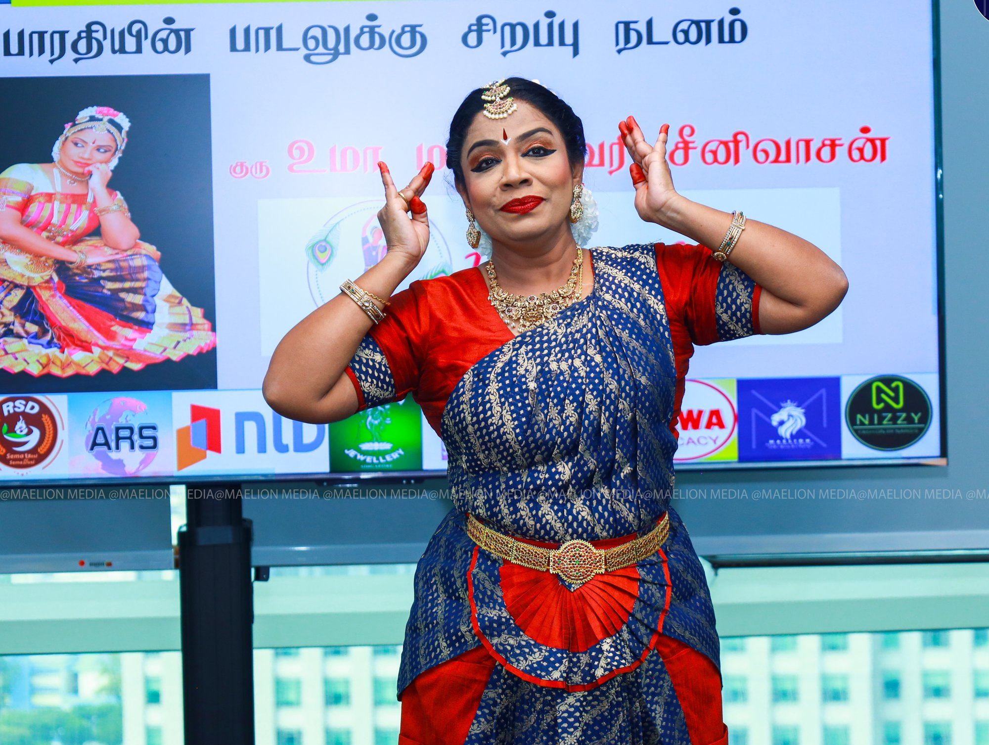 Guru Uma in a Bharatanatyam pose on stage