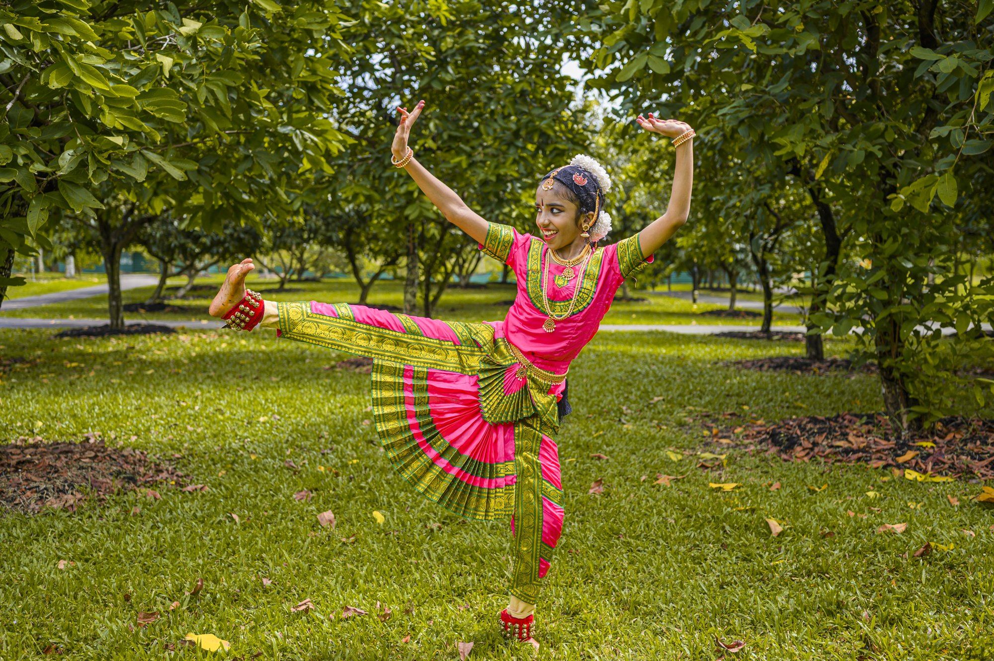 A student in a dynamic leg-extension pose